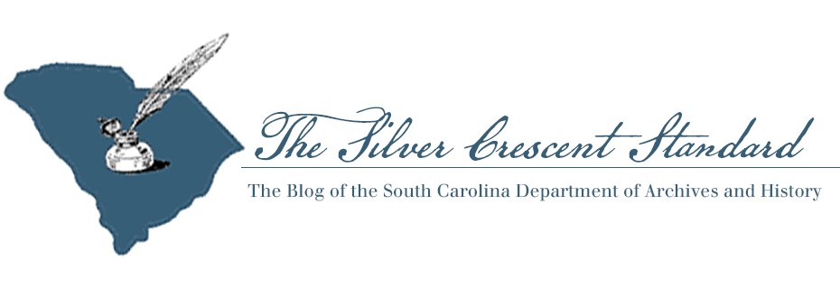Banner reading "The Silver Crescent Standard: The Blog of the South Carolina Department of Archives and History". Graphic of the state of SC with a quill pen and inkstand in the center.
